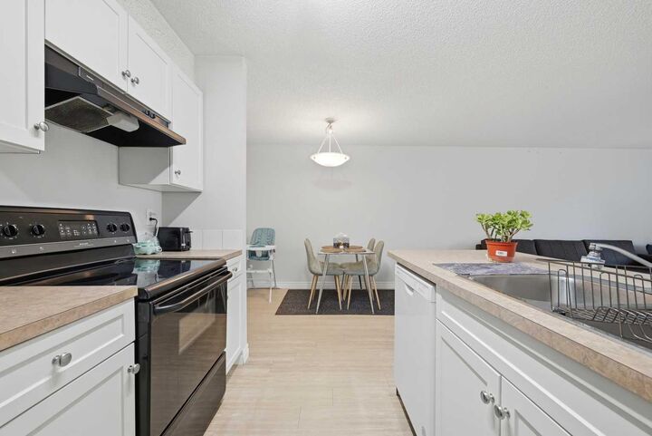 Property Photo:  5555 Falsbridge Drive NE 111  AB T3J 3E8 
