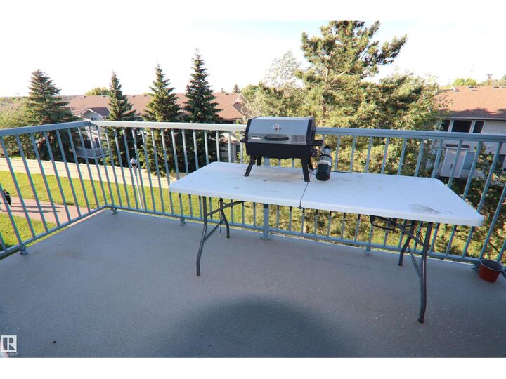 Property Photo:  #421 6720 158 Av NW  AB T5Z 3B1 