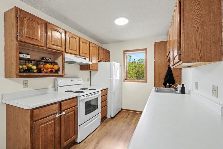 Property Photo:  3265 80th Street E 207  MN 55076 
