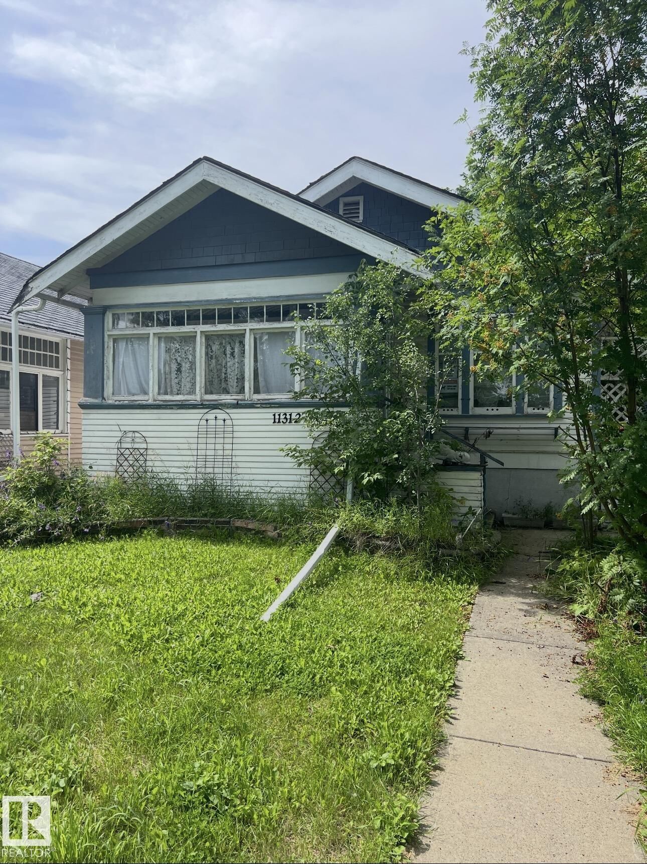Property Photo:  11312 97 Street NW  AB T5G 1X4 