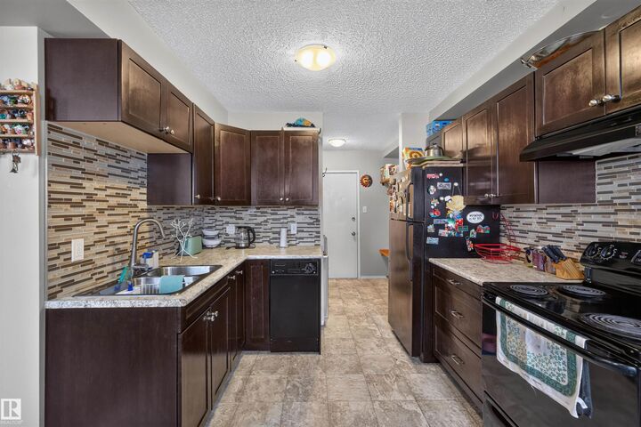 Property Photo:  14520 52 St NW 102  AB T5A 3K5 
