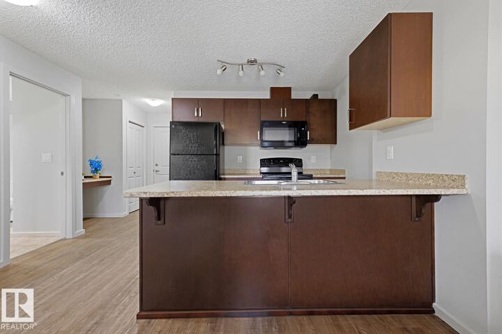 Property Photo:  5521 7 Avenue SW 303  AB T6X 2A8 