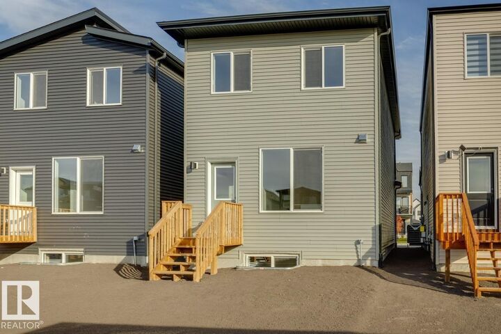 Property Photo:  7530 Klapstein Link SW  AB T6W 5T2 