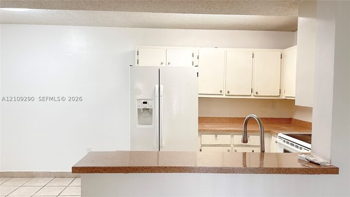 Property Photo:  9491 S Palm Cir S 103  FL 33025 