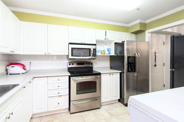 Property Photo: 9626 148 Street 201 BC V3R 0W2