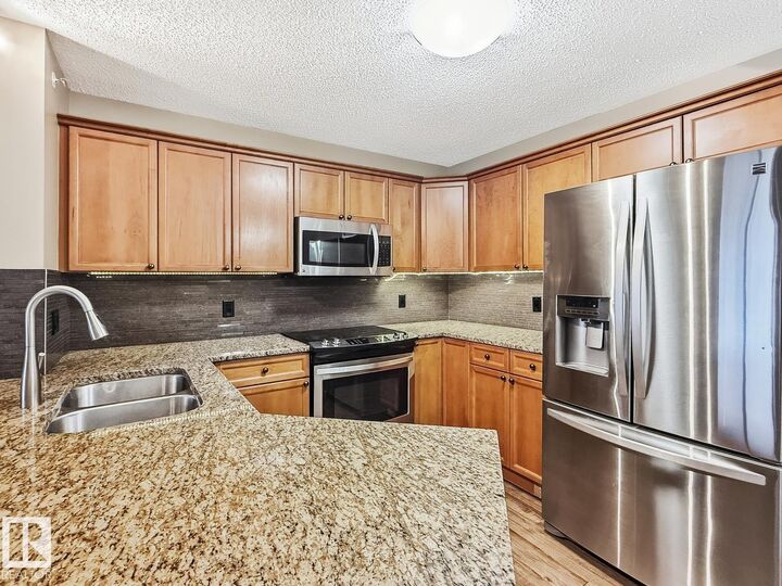 Property Photo:  13830 150 Avenue NW 406  AB T6V 1X2 