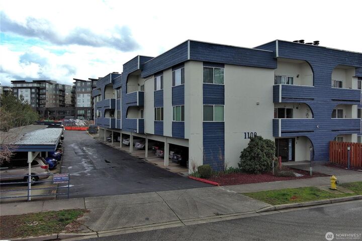 Property Photo:  1100  Harrington Avenue NE 205  WA 98056 